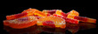 Close-Up of Sugary Orange Fruit Slices Against Black Background