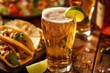 Cold Beer with Lime Wedge and Beef Tacos - Perfect Mexican Dinner with Refreshing Beer