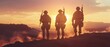 In the light of the sunset, three fully equipped and armed soldiers stand on a hill in a desert environment.