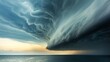 Shelf cloud ominously stretching across the sky over the ocean