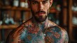 © nataliya_ua - tattoo design covering a male chest and arm
