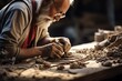 An old man is carefully sculpting a piece of clay.