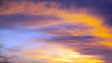Fototapeta  - Picturesque view of orange sky with dark clouds in sunset time. Textured background of beautiful sunset. Beautiful background blur.