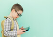 Boy with school backpack holding tablet