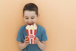Caucasian boy with popcorn copy space