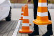 Driving instructor puts cones before the driving test