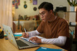 © DragonImages - High school student having online class