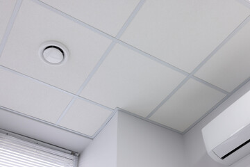 Wall Mural - White ceiling with PVC tiles indoors, low angle view