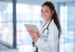 © peopleimages.com - Portrait, woman and doctor with tablet, smile and telehealth for medical research, online schedule and career. Face, person or medical with professional, technology and news for breakthrough medicine
