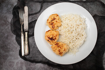 Poster - Fried chicken meatballs with boiled rice on plate