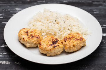 Sticker - Fried chicken meatballs with boiled rice on plate