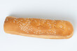 One hotdog bun with seeds