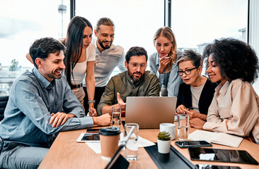 Brainstorm session. Corporate business team checking with interest project presentation on laptop from bearded male. Program developer asking colleagues for advice about features and fixing bugs.