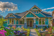 The elegant frontage of a vibrant cerulean craftsman cottage style house, featuring a triple pitched roof, tastefully designed landscaping, a welcoming path, 