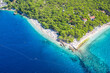 Punta Rata beach in Brela, Croatia, aerial view. Adriatic Sea with turquoise clean water and white sand on the beach.