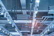 Directional LED lights on rails under the ceiling in a modern warehouse, shopping center building, office or other commercial real estate object.