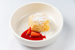 cake with strawberry sauce on white plate