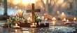 A wooden cross with snowdrops on a table, candles and an abstract background. Representation of faith in God, Easter, Palm Sunday, Lent, and a Christian festival.