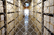 Document archive, defocused view through wire mesh on the storage