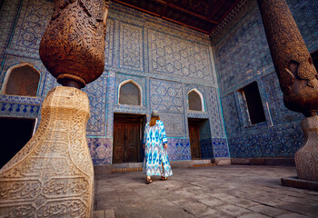 Wall Mural - Woman tourist at old city Khiva in Uzbekistan