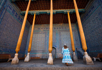 Wall Mural - Woman tourist at old city Khiva in Uzbekistan