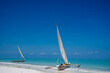 Sailboat in indian ocean on blue sky.