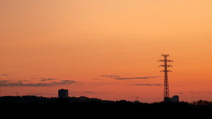 Wall Mural - silhouette of the city against the background of a pink summer sunset