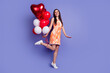 © deagreez - Full length portrait of nice lady hold balloons empty space wear dress isolated on purple color background