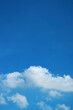 White Fluffy Clouds Floating on Vivid Blue Sky