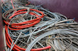 discarded electrical cords at the electrical cord scrapyard for recycling copper and polluting plastic