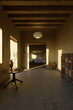 clay house with old interior furniture in the sunny evening light. 3D Rendering