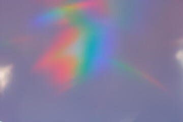 Sunlight background, abstract photo with sunshine and rainbow flare, vivid colored minimal photo. Prism light and caustic effects texture, trendy aesthetic view diffraction sunbeams, blur glow