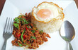 Plate of Popular Thai Dish of Kao Pad Kaprao Neua or Stirred-fried Minced Beef and Holy Basil with Rice