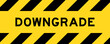 Yellow and black color with line striped label banner with word downgrade