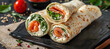On a butter dish, smoked salmon and cream cheese wraps