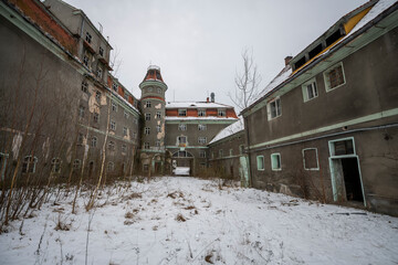 Wall Mural - Exploration of the historic old stone mill with a spiral staircase in Southern Poland, Europe, in Winter