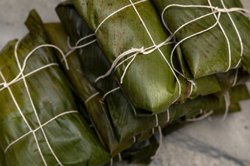 Wall Mural - Hallaca or tamale wrapped in banana leaf. Traditional food