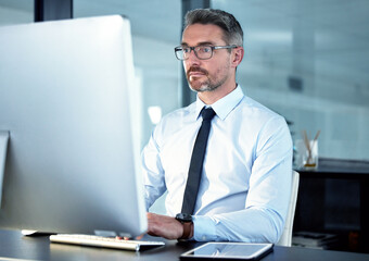 Business, man and computer for office, working and corporate email for connection. Lawyer, law firm and technology for online research, legal project and website reading in formal workplace.