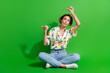 Full body photo of wearing shirt orange print denim jeans ponder lady looking directing fingers novelty isolated on green color background