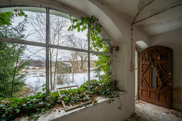 Wall Mural - Exploration of the historic old stone mill with a spiral staircase in Southern Poland, Europe, in Winter