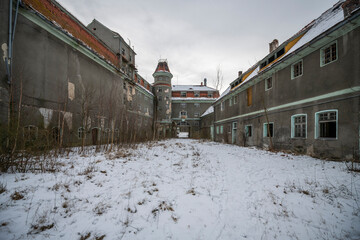 Wall Mural - Exploration of the historic old stone mill with a spiral staircase in Southern Poland, Europe, in Winter