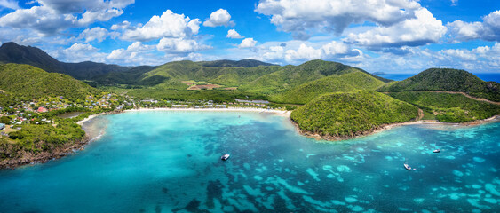 Wall Mural - panoramic aerial view of carlisle bay beach with lush rain forest and turquoise and emerald sea, ant