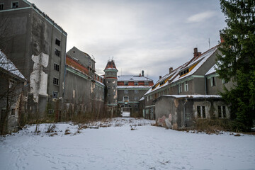 Wall Mural - Exploration the historic old stone mill with a spiral staircase in Southern Poland, Europe, in Winter