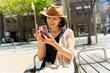 © taka - 街角でスマホを見る50代女性