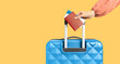 female hand holding the handle of a suitcase and holding a passport and tickets on a yellow background