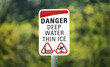 Danger, deep water, thin ice. Warning sign on the lake in Canada