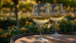 Two wine glasses on a wooden barrel in front of an outdoor garden, AI