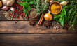 Herbs and spices on a wooden background 