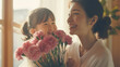母の日に花束を渡す女の子とママ