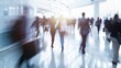 © Daria - Blurred business people walking at trade fair or conference, motion speed blur in modern hall